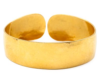 21.6k Yellow Gold Bracelet. 
Hand hammered texture. 
Marked (900). 
19-21mm. 
64.65gr.