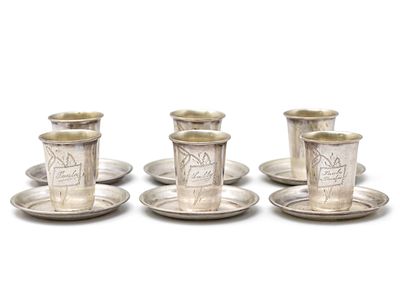 Set of Six Silver Tots and Coasters. 
Engraved ornaments. 
Marked (84P). 
Tot height: 