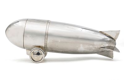 Novelty Silver Plated Zeppelin Air Ship Cocktail Shaker. 
Modeled as a Zeppelin air ship with 
