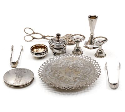 Lot of Silver Items. 
Including two salt cellars, Persian plate, Three candlesticks (pair by 