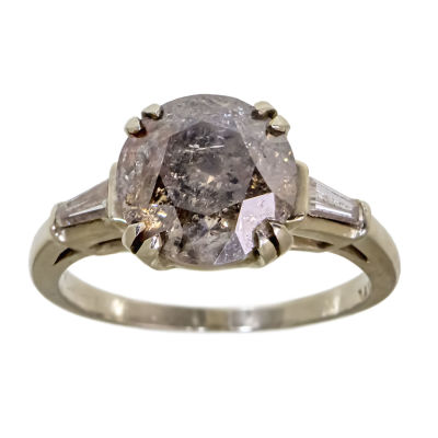 14k White Gold Diamond Ring. 
Set with a center diamond of about 3.3ct. 
Two taper diamonds 