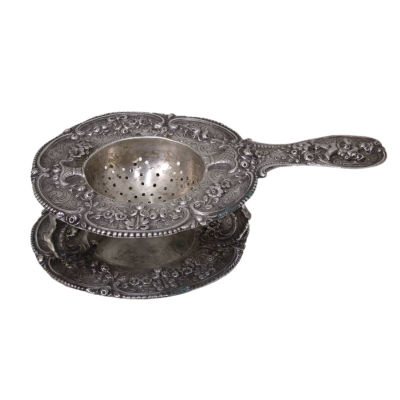 Silver Tea Strainer on Stand, Germany, Circa 1900. 
Embossed and engraved floral and foliage 