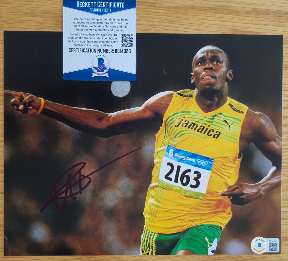 אוסיין בולט האצן הטוב בעולם , 
חתימה ידנית על צילום מאומתת בחברה הטובה בעולם BECKETT