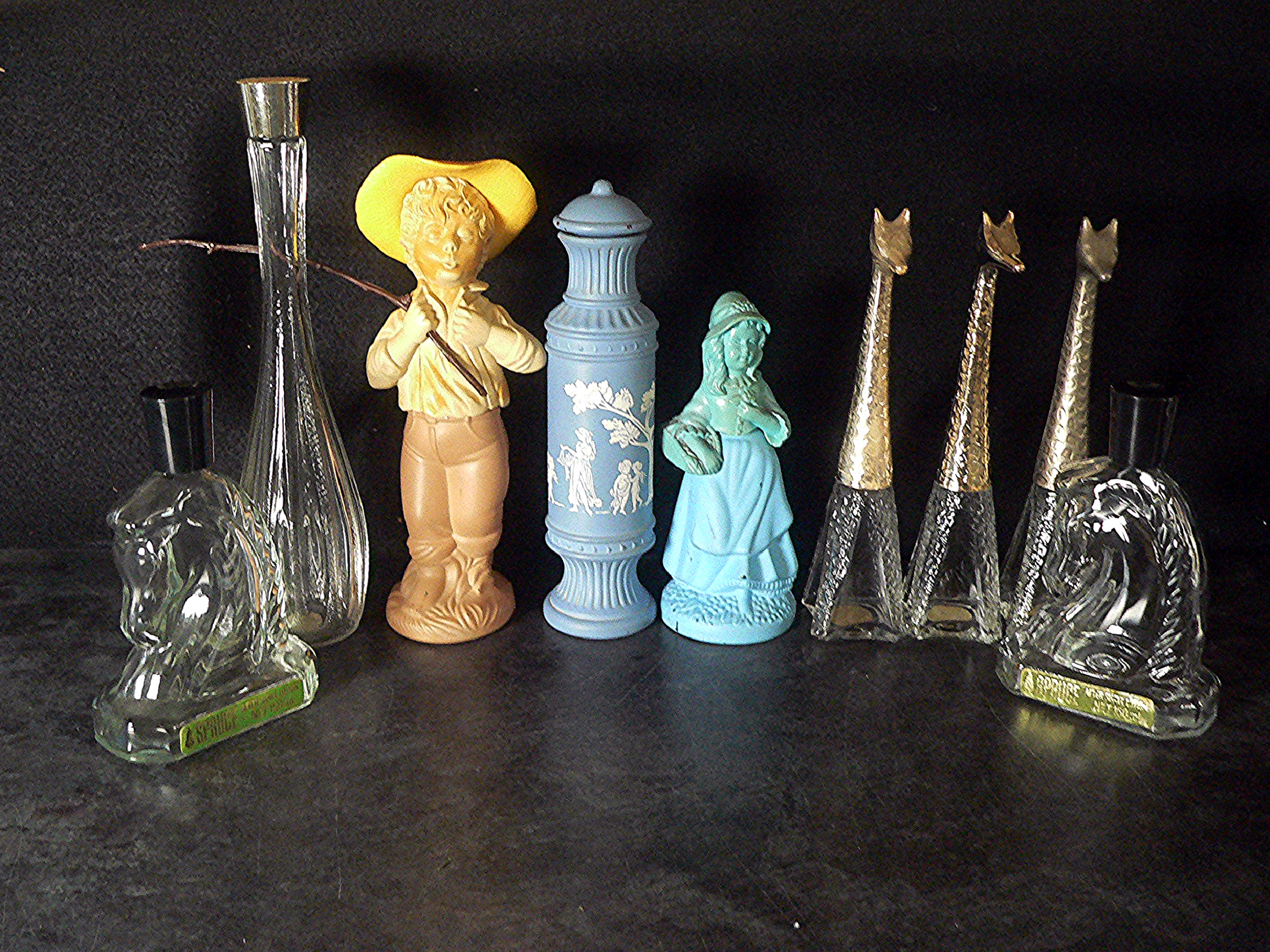 Nine discontinued, empty, Avon bottles