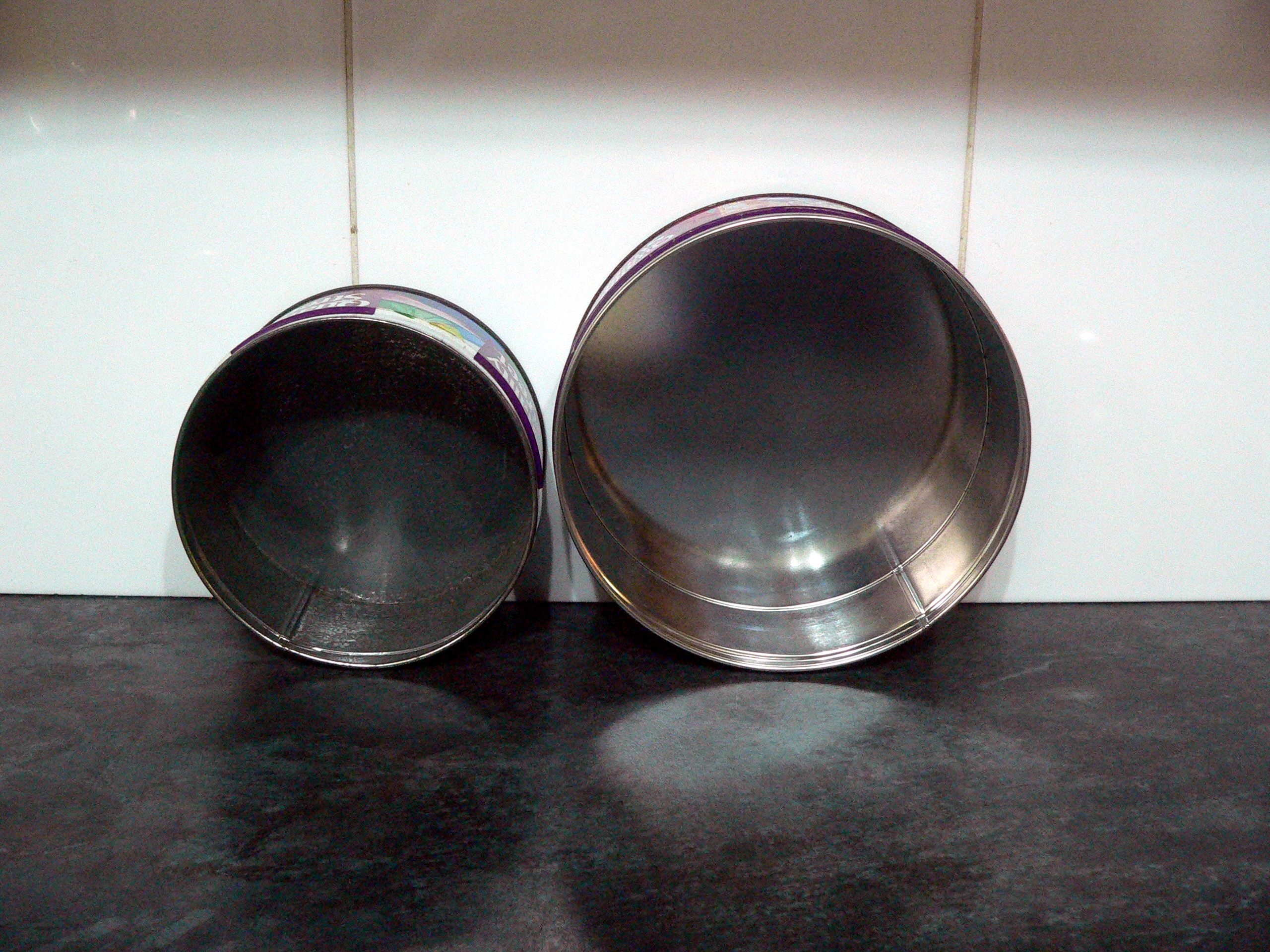 Pair of 2004 and 2008 metal Quality Street Tins
