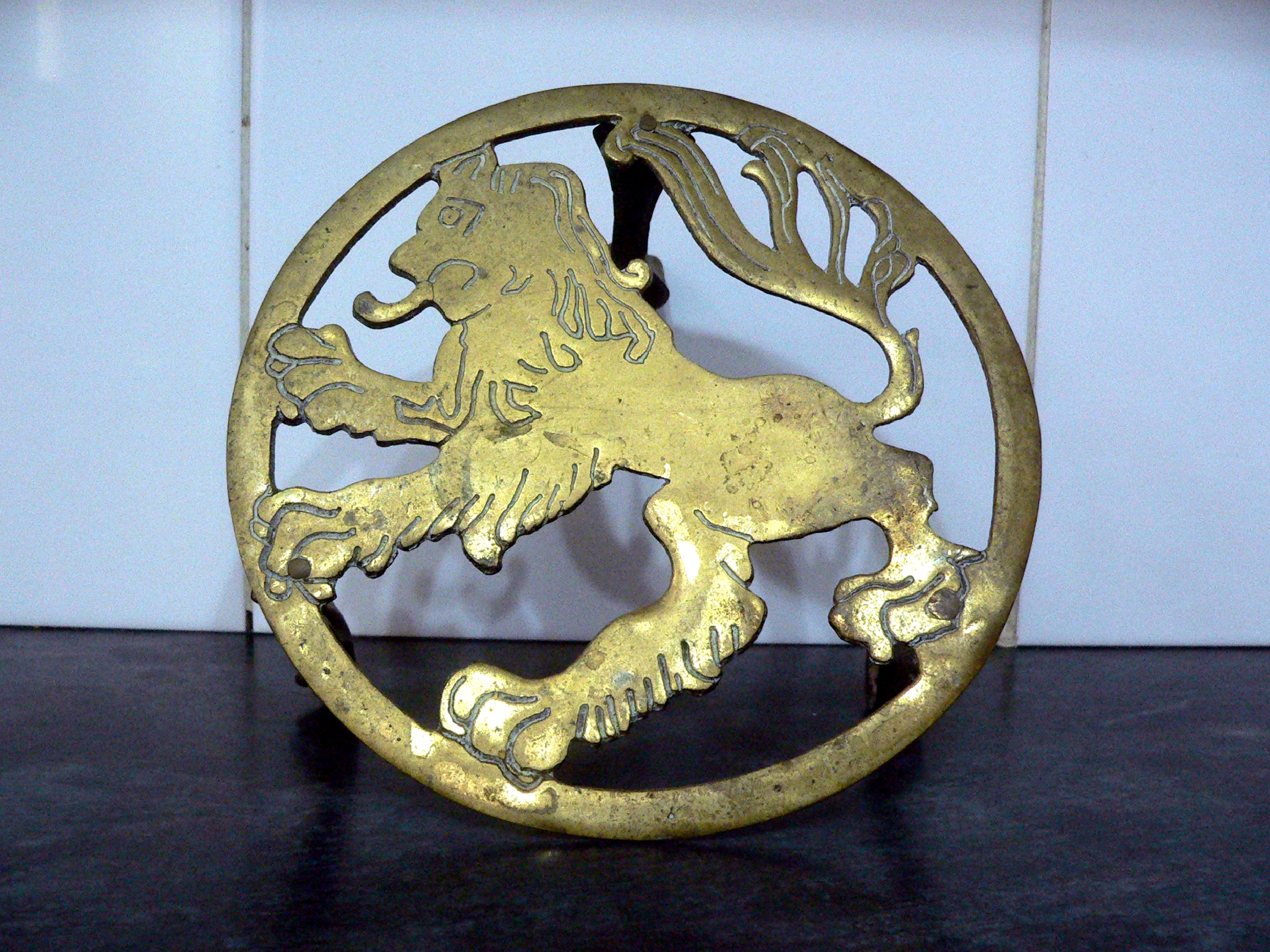 7" diameter vintage brass lion tripod trivet