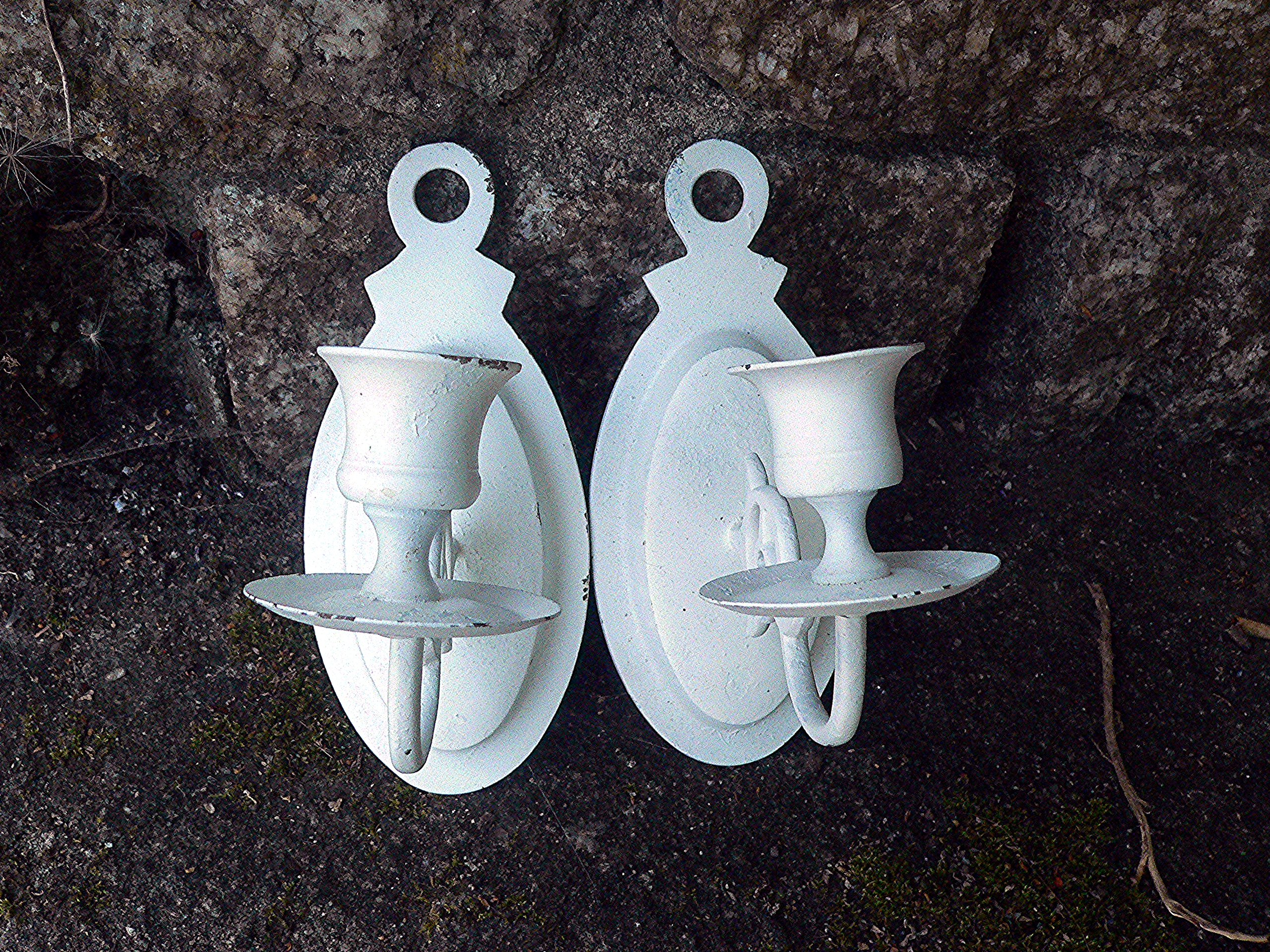 Pair of brass wall mounted candle holders