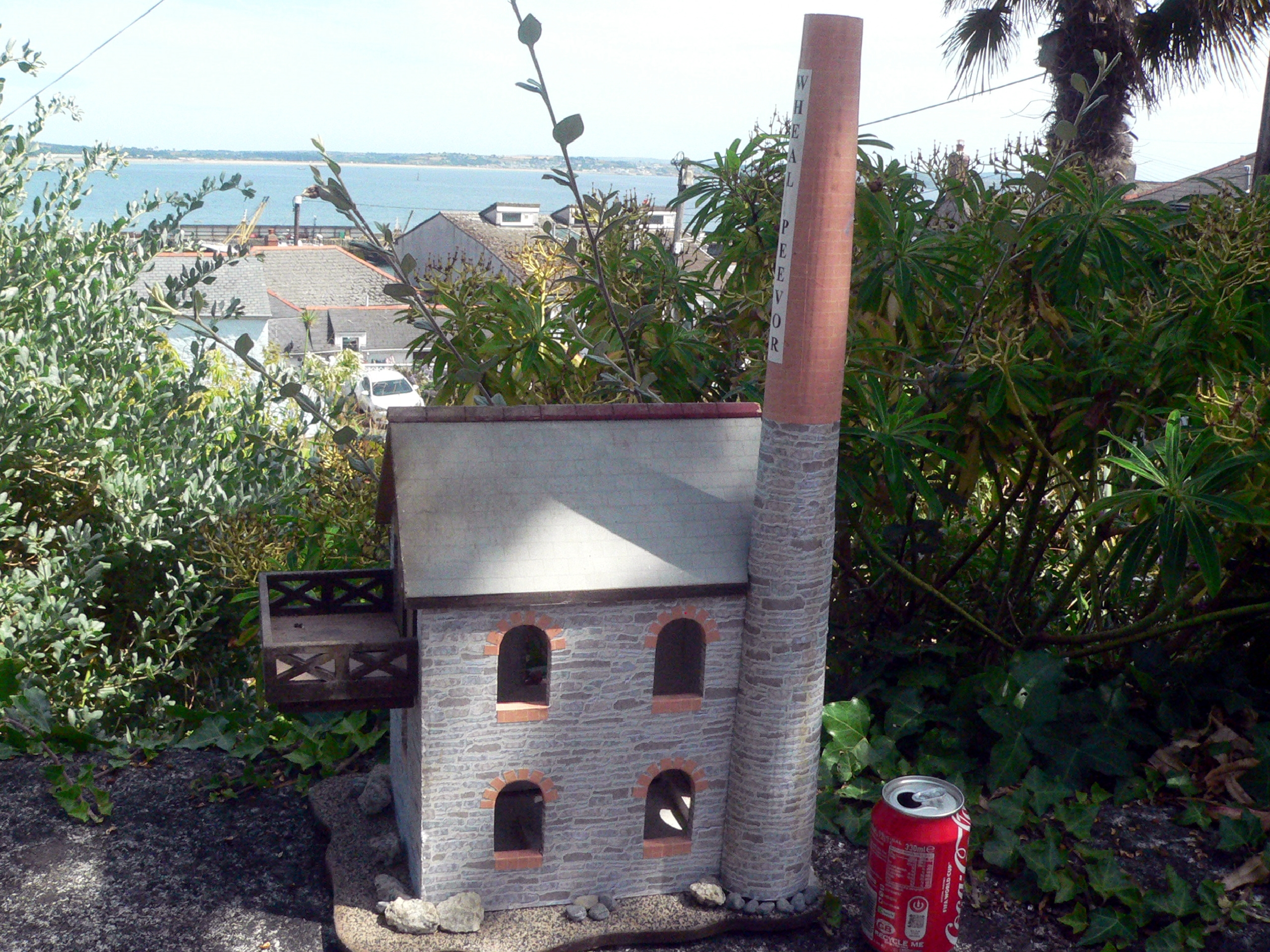 NO POST . Large wooden model of Wheal Peevor (Redruth, Cornwall) There's a gargoyle, a mouse in the window, granite stones and two light up, battery powered "candles" on the interior (untested). Can be removed from the base (see last photo) Heavy and stur