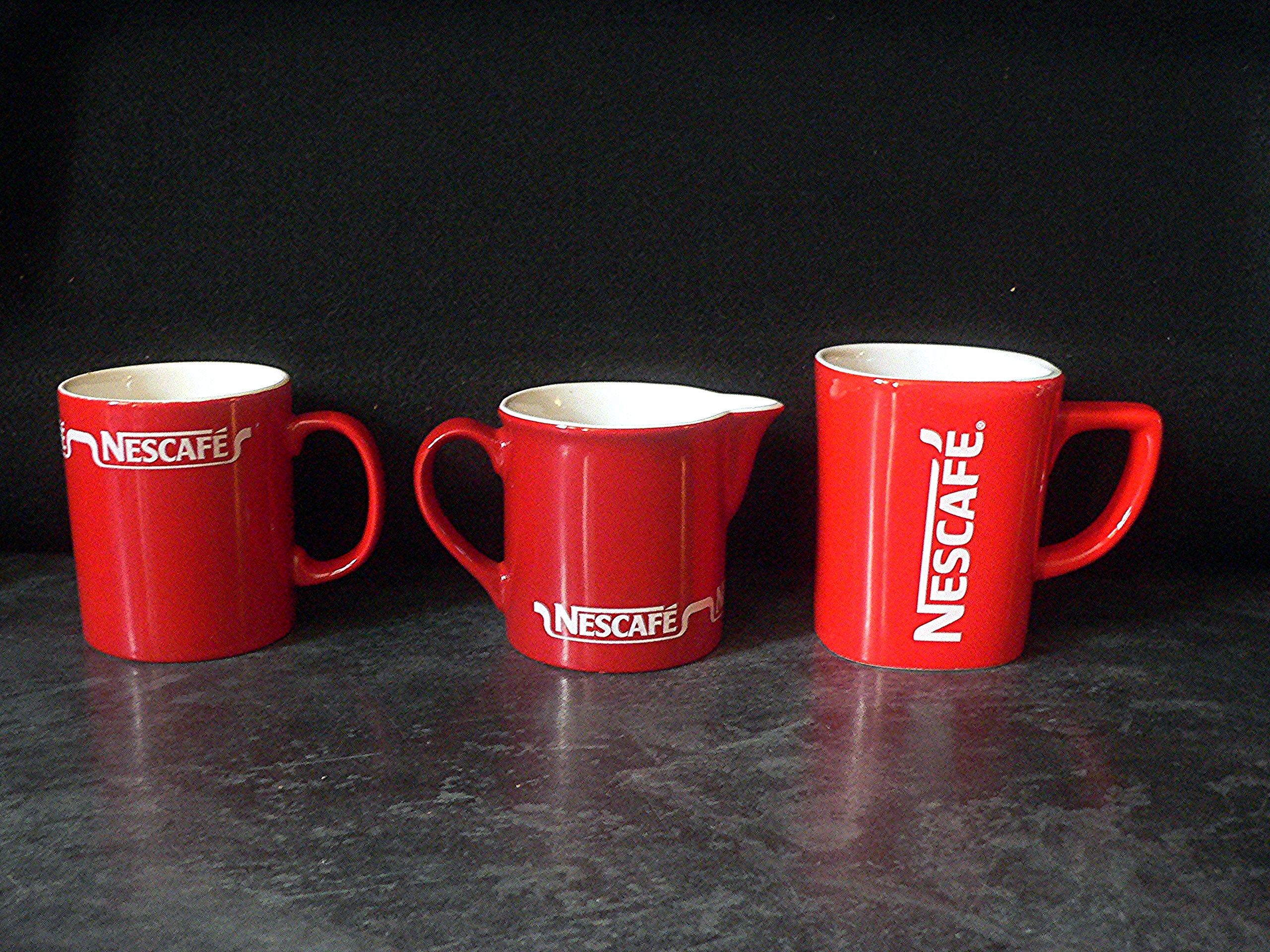 Trio of Nescafe branded items, two mugs and a reasonably hard to find jug
