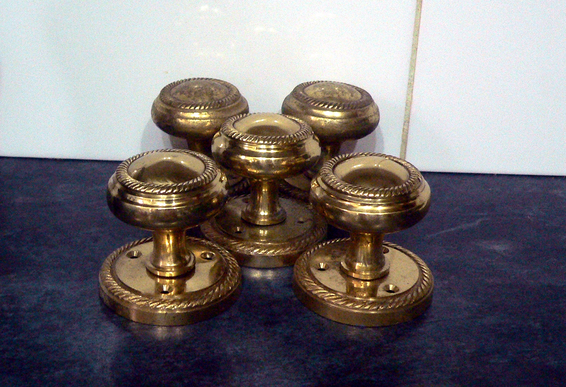 Five brass doorknobs