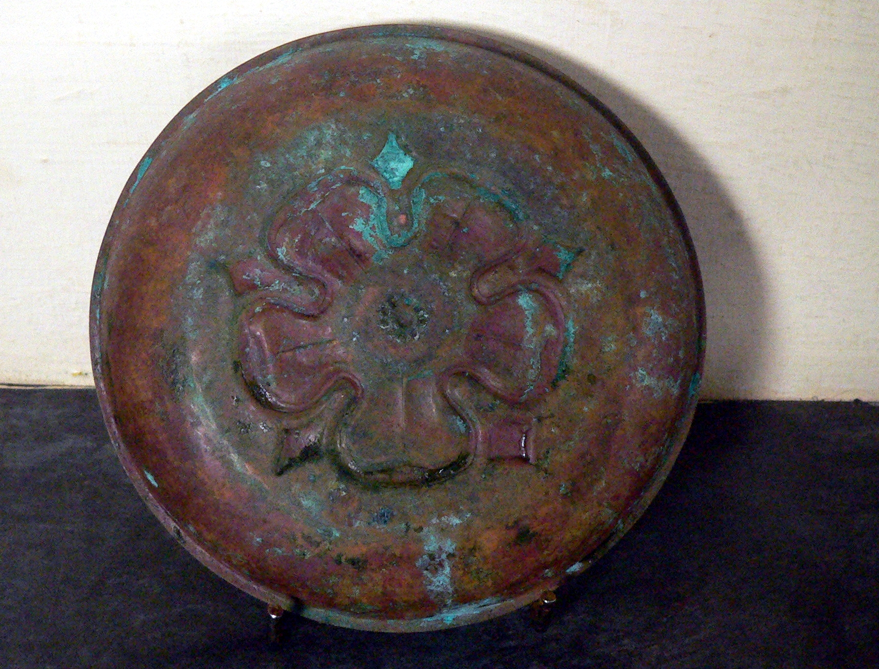 Interesting copper dish with significant age related patina.