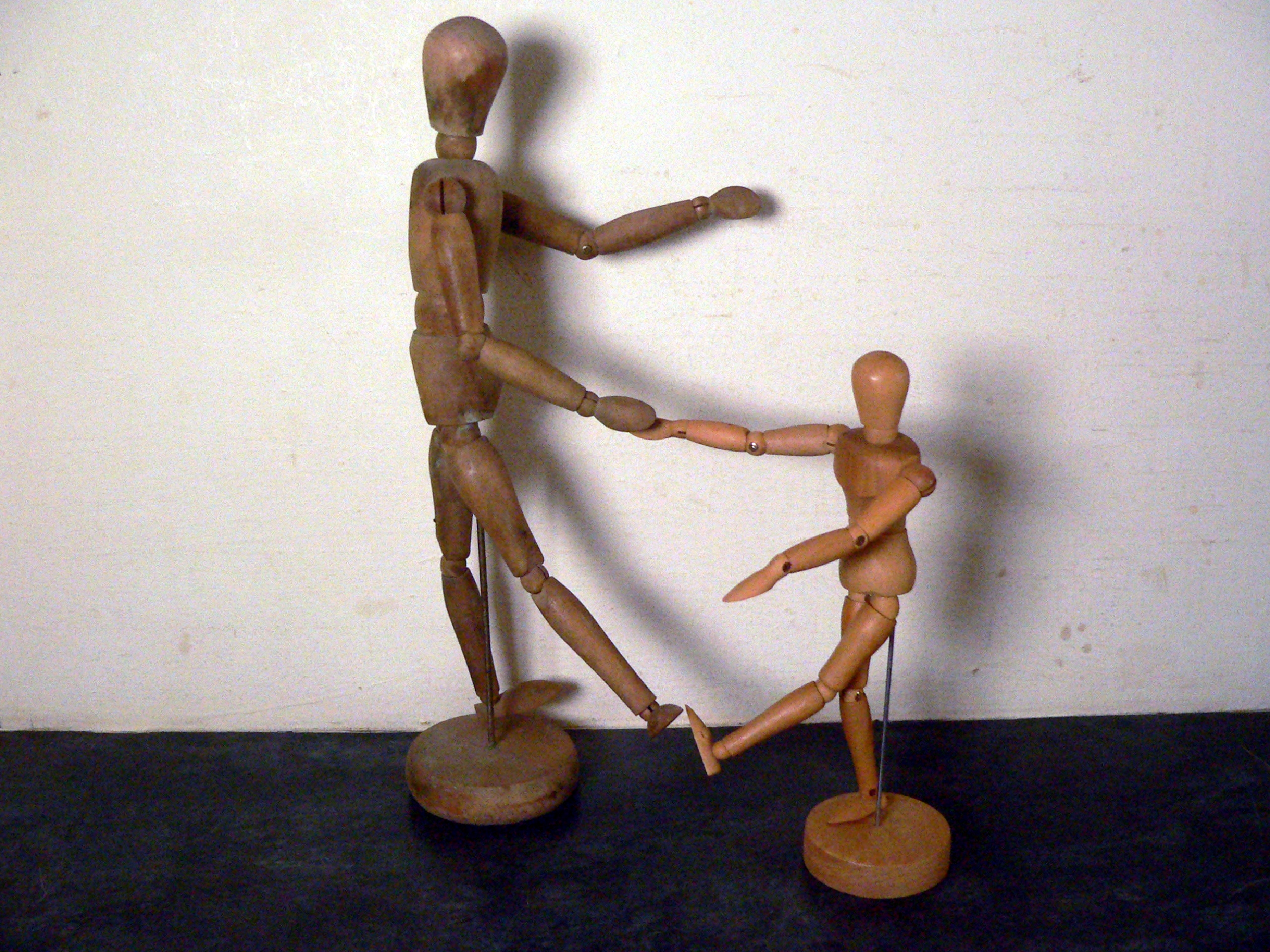 Pair of vintage, wooden artist's mannequin dummies.