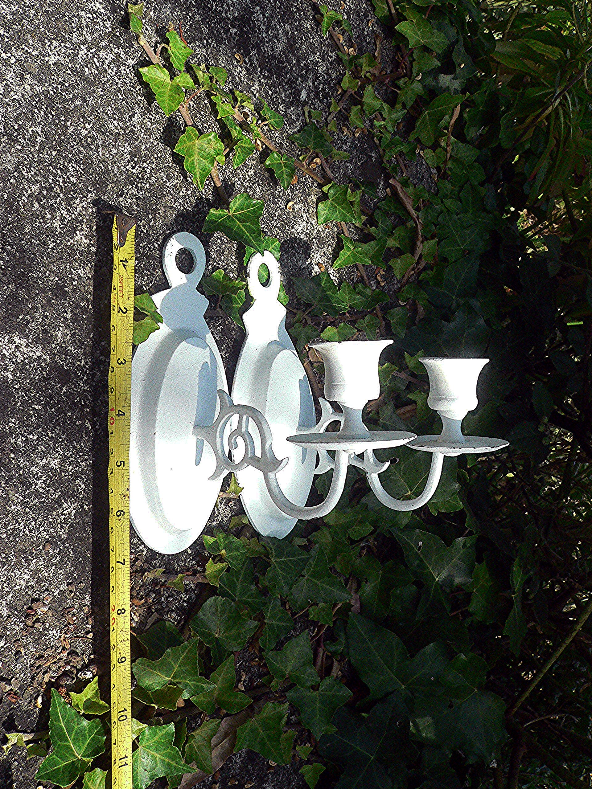 Pair of brass wall mounted candle holders