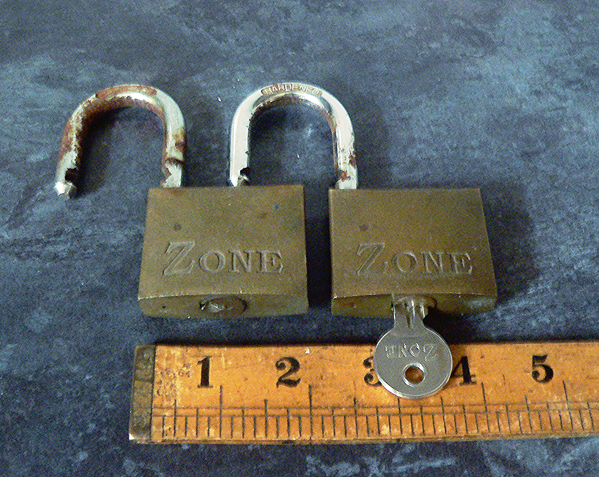 Pair of Zone brass heavy duty padlocks with one key that opens both