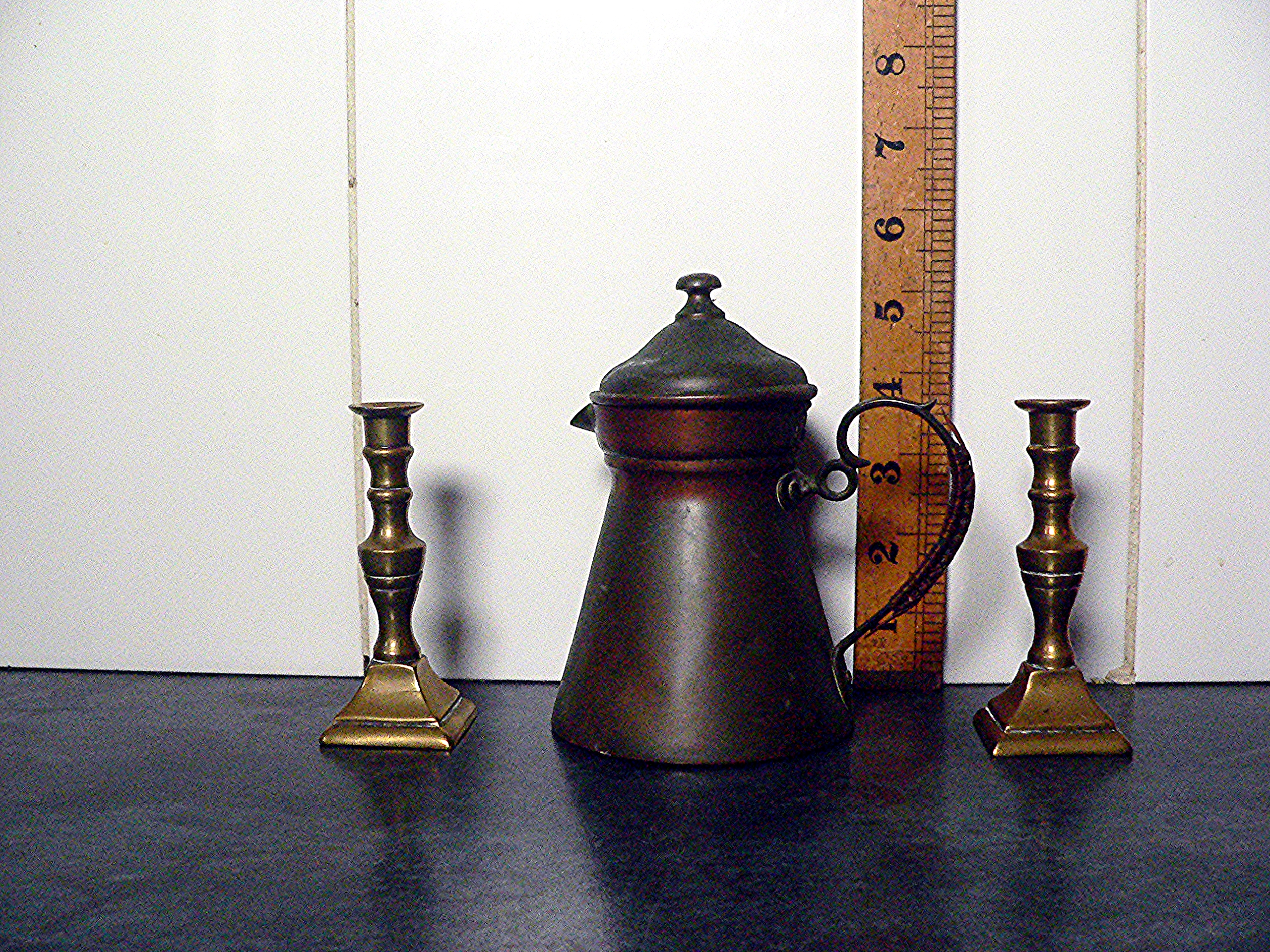 Copper coffee pot & two brass candlesticks