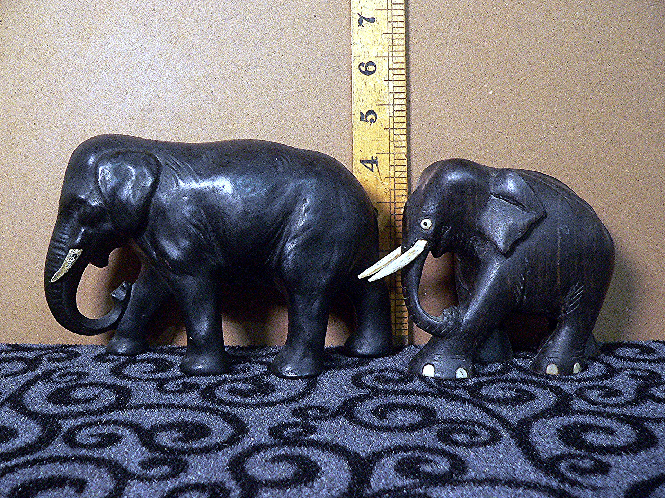 Carved wooden and ceramic elephants.
