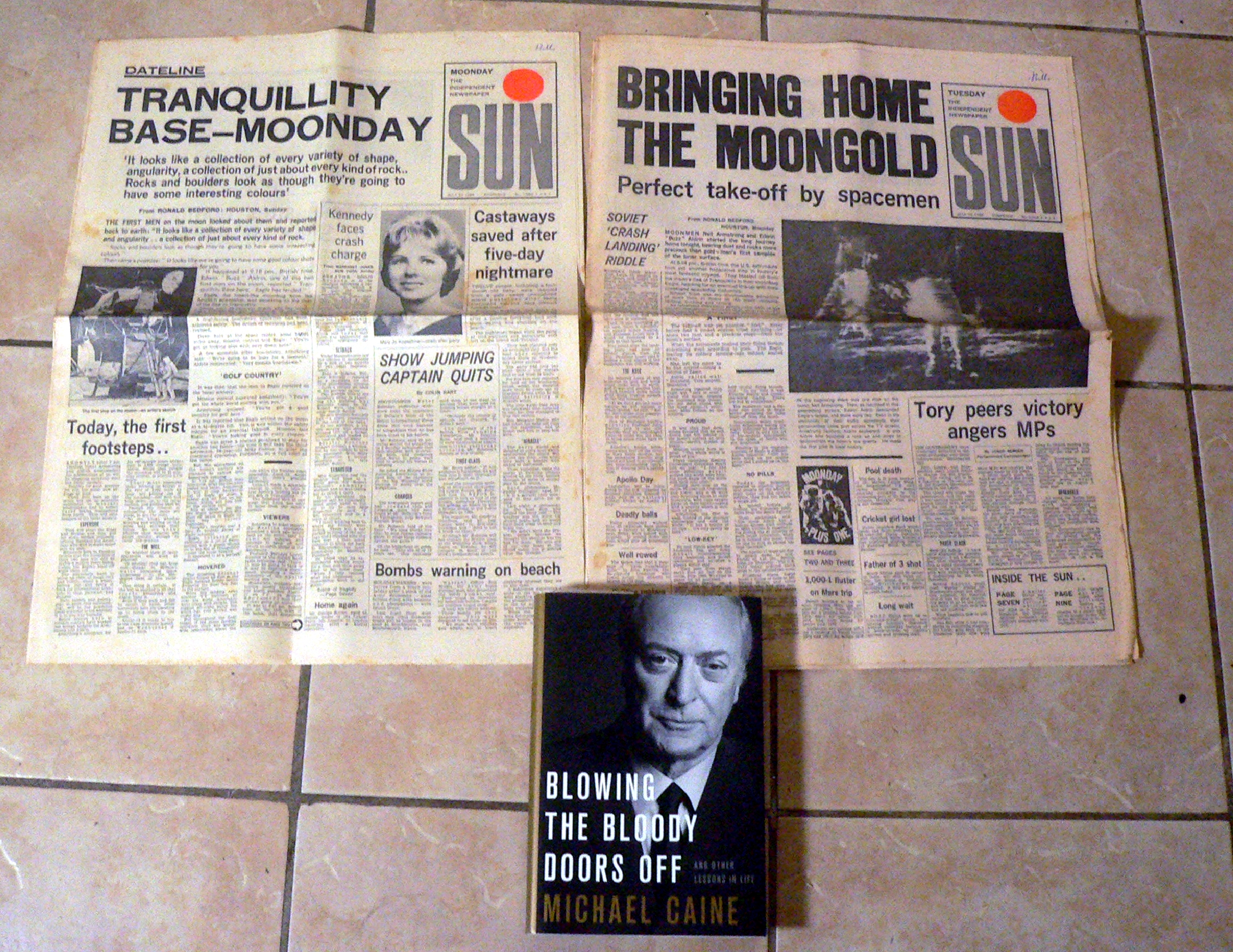 Pair of original 1969 Sun newspapers and a Michael Caine hardback book with dust jacket..