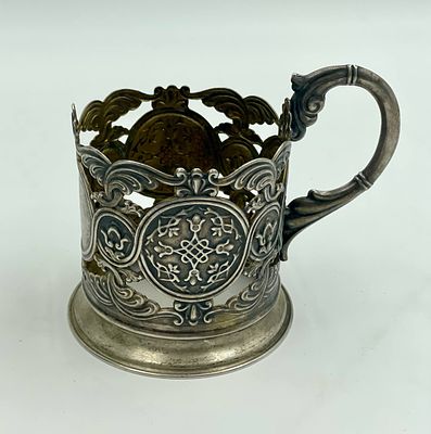 Подстаканник. XX в. Серебро 875 пробы (клеймо) 
в - 9,5 см 
д - 7 см