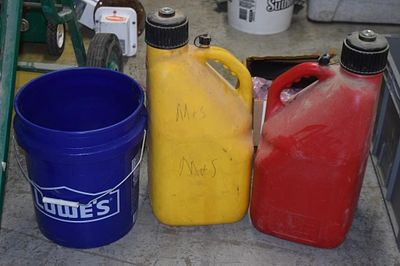 A Lowe's Blue Plastic Bucket and Two VP Racing. 5.5