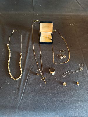 An Assortment of 10K Gold and Yellow Metal Jewelry Including Balfour and Herff Jones Rings. This 