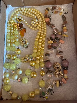 A Collection of Mid-Century Costume Jewelry Including Beaded Necklaces, Earrings, and Brooch. Thi 