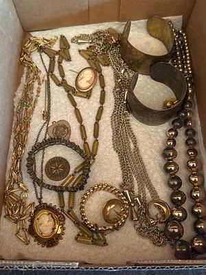 An Assortment of Vintage Costume Jewelry including Necklaces, Bracelets, and Brooches. This 