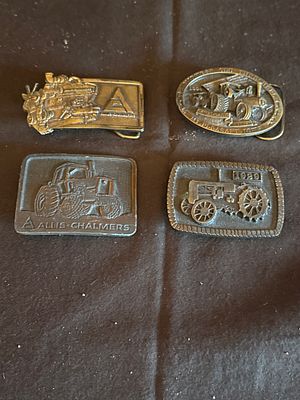 A Collection of Commemorative Agricultural Machinery Belt Buckles. This collection of metal belt 