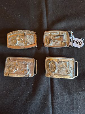 An Assortment of Cast Metal Commemorative Agricultural Tractor Belt Buckles. This collection 