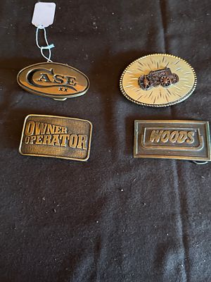 A Collection of Agricultural and Industrial Advertising Belt Buckles. A collection of cast metal 