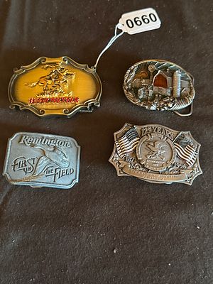 A Collection of Americana and Firearms Themed Cast Metal Belt Buckles. A collection of 