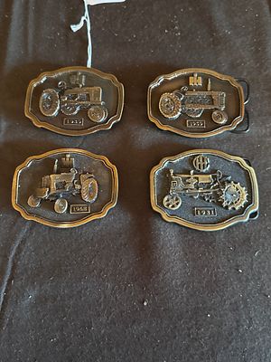 A Collection of International Harvester Farmall Commemorative Belt Buckles. A collection of 