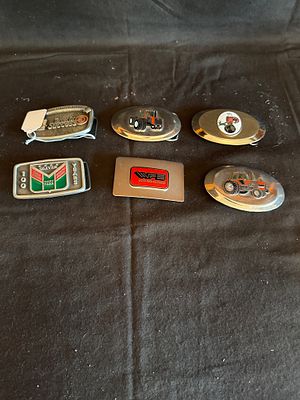 A Collection of Agricultural and Farm Equipment Advertising Belt Buckles. A collection of cast 