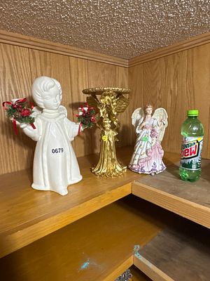 A Trio of Decorative Angel Figurines in Ceramic and Resin. This lot consists of three decorative 
