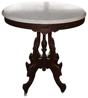 Victorian Renaissance Revival Oval Marble Top Walnut Parlor Table. This Victorian Renaissance 