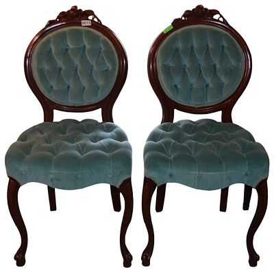 A Pair of Victorian Rococo Revival Style Carved Hardwood Side Chairs. A pair of side chairs in 