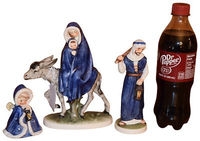 A Trio of Goebel Hummel Flight Into Egypt Porcelain Figurines. A set of three glazed porcelain 