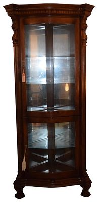Traditional Style Bow Front Corner Curio Cabinet Attributed to Pulaski. This corner curio 