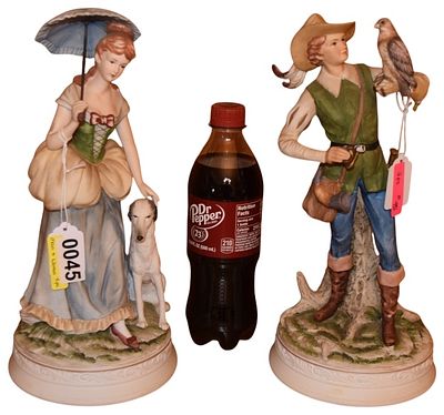 A Pair of Classic Gallery Collection Bisque Porcelain Figurines. A pair of hand-painted bisque 