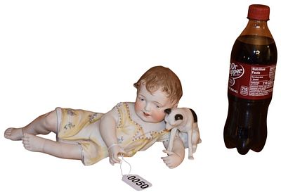 Victorian Style Bisque Porcelain Reclining Child and Dog Figurine. This Victorian-style bisque 