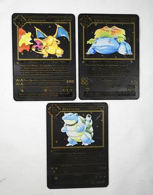 (3) POKEMON BLACK METAL 1st EDITION. CHARIZARD, BLASTOISE & VENUSAUR