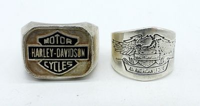(2) STERLING HARLEY DAVIDSON RINGS. TWO STERLING SILVER HARLEY DAVIDSON RINGS, ONE HAS TAPE 