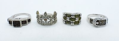 GREEN, RED, BROWN & WHITE DIAMOND RINGS. FOUR STERLING RINGS WITH DIAMONDS & MOISSANITE. EACH 