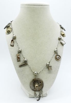 VINTAGE SILVER CHARM NECKLACE. VINTAGE SILVER (TESTED 70% SILVER) CHARM NECKLACE. SOUTH AMERICAN 