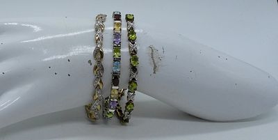 (3) STERLING VINTAGE GEMSTONE BRACELETS. THREE STERLING, VINTAGE BRACELETS. PERIDOT, BLUE TOPAZ 