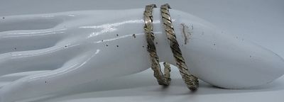 (2) STERLING MEXICO BANGLE BRACELETS. TWO STERLING MEXICO BANGLE BRACELETS. (22 DWT)