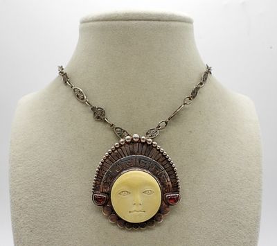 SAJEN 925 AZTEC FACE GARNET PENDANT. SAJEN AZTEC FACE WITH HEADDRESS, GARNET GEMSTONES, CARVED 