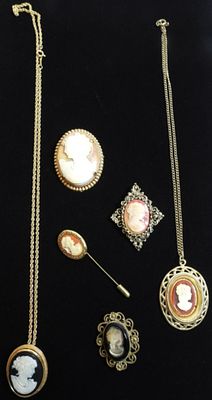 Camio Lot. (2) Gold-tone necklaces. (1) Hat pin. (3) Brooches. One of the necklaces can be worn 