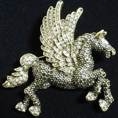 Pegasus Brooch. gold/bronze tone with black gems