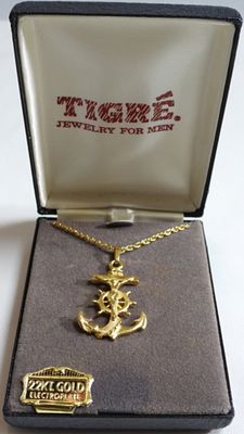 Necklace. Like new in the box. Jesus on an anchor. 22kt gold electroplate