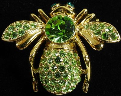 Joan Rivers. Peridot color stones in gold tone